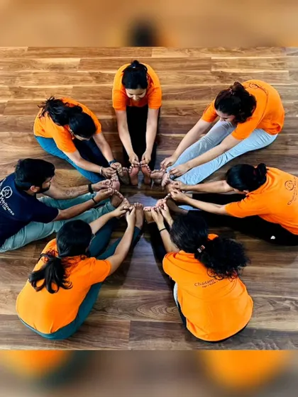 More fun with group yoga formations! These images capture the playful spirit and strong bonds forged in our training programs. It's all about connection and support.