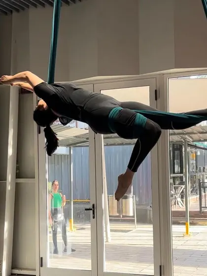 The triumphant result of dedication and personalized care. Our patient is back to her passion, performing aerial yoga with strength and grace. This photo embodies the goal of all our rehabilitation programs: a full return to the life you love.
