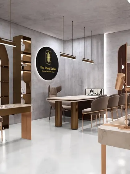An overview of the jewelry studio, showing the various display tables and consultation areas. The monotonous color palette allows the jewelry to be the main focus.