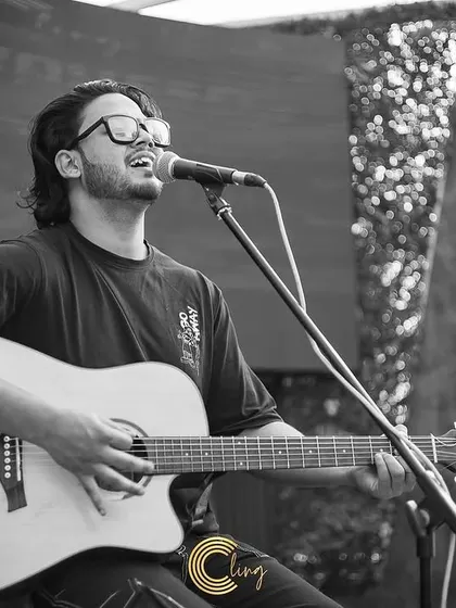 A black and white photo capturing the emotion of a live performance. I focus on delivering soulful vocals that truly connect with the audience.