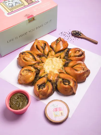 For a savoury option, I make this Pesto Cheese Snowflake bread. It's filled with my homemade pesto and lots of cheese, making it a fantastic party appetizer.