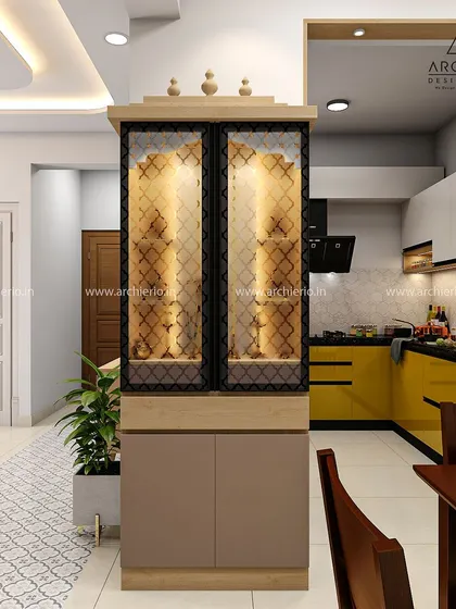 A pooja unit with CNC-cut glass doors, providing a glimpse of the sacred space within while blending with the modern dining area.
