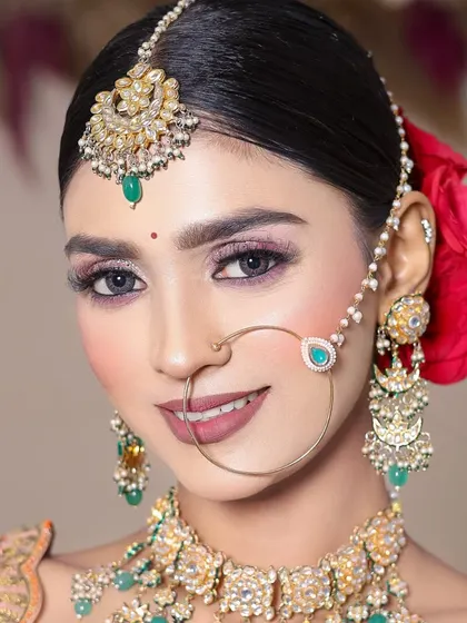 A beautiful portrait of the final look created by a student, showcasing her skills in both makeup and hair.