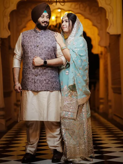 A classic pre-wedding portrait in a heritage location. The couple's traditional attire complements the elegant architecture.