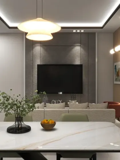 This view from the dining area into the living room shows how I create a cohesive design with a consistent color palette and modern lighting fixtures.