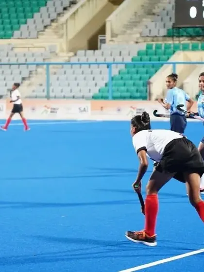 A wide view of the on-field action during the match against Delhi Hockey. My players maintain their formation and strategic positioning across the pitch.