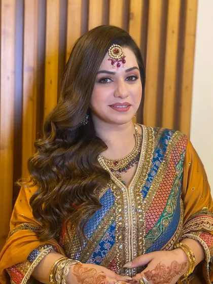 My beauty with classic Hollywood waves for a traditional event. This timeless hairstyle adds a touch of old-world glamour.