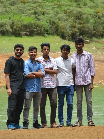 A duplicate of the group posing by the water. We make sure to get plenty of group photos to remember the trip by.