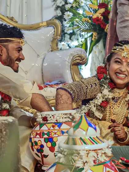 I live for capturing pure, unscripted joy like this. This moment happened during a traditional wedding game, and the bride's spontaneous laughter is what makes the photo so special. It's these candid shots that truly reflect the happiness of the day.