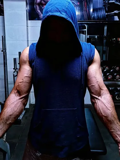 A physique forged through years of dedication to heavy lifting and combat sports training. This is the result of a no-nonsense approach to fitness.