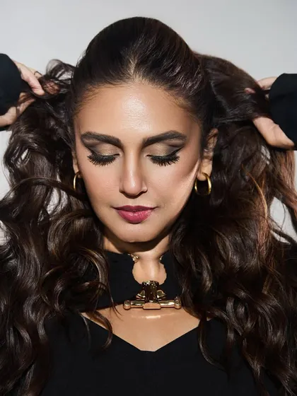 A beauty shot focusing on Huma's gorgeous hair and makeup, with the unique neckline detail of the dress adding a point of interest.