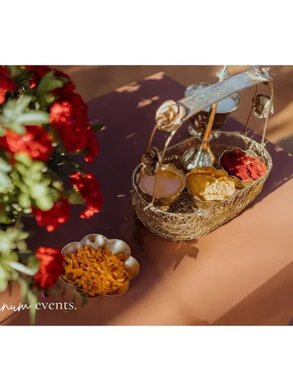 Traditional items for the ceremony, beautifully arranged with fresh flowers.