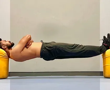 Maintaining the integrity of the plank pose. The key is to engage the core and avoid sagging in the hips, creating a solid foundation of strength.
