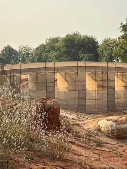 A closer view of the bridge mock-up, showing how the fabric captures the light. This process of large-scale modeling is essential for ambitious landscape interventions.