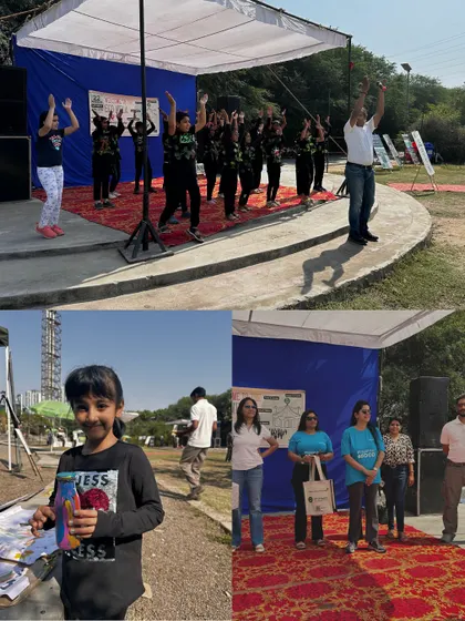 Participants join in a Zumba session on stage at the Eco Mela, combining fitness, fun, and environmental awareness.
