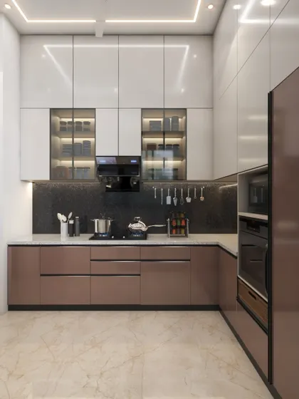 A modular kitchen design that is perfect for compact spaces. The glossy white and brownish-pink cabinets create a glamorous look, while the design maximizes functionality.