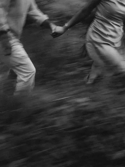 An abstract black and white shot capturing the motion of them running together. It’s an artistic representation of their journey, full of energy and connection.