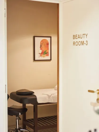 A peek into one of the private beauty rooms. The space is designed to be simple, clean, and calming, with neutral tones and soft lighting to provide a private and relaxing environment for treatments.