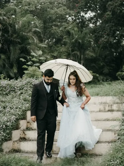 A romantic moment under an umbrella. Even a little rain can’t stop us from creating beautiful memories.