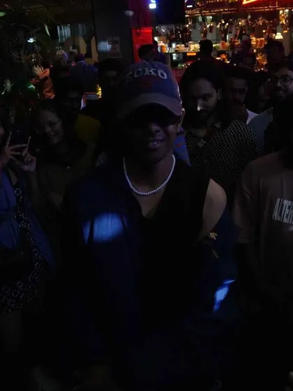A dancer in the crowd at our Social Sunday Sundowner, feeling the music.
