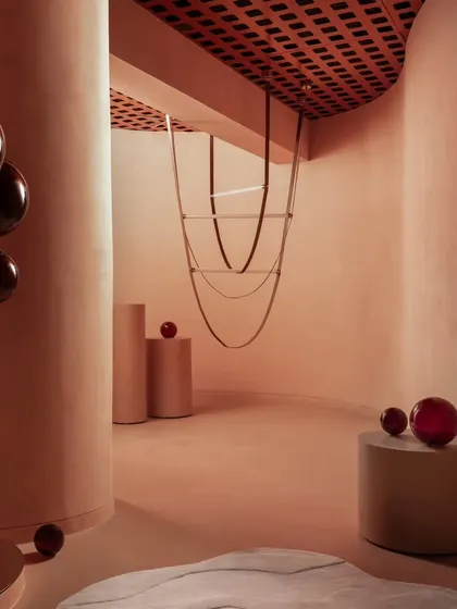 This is a glimpse into the retail store we designed for Prism Lights. Our goal was to create a minimalist, luxurious shell that would let the bespoke lighting fixtures be the true heroes. We used curved forms and a soft, monochromatic peach palette to create a gentle flow and a warm, inviting atmosphere for customers.