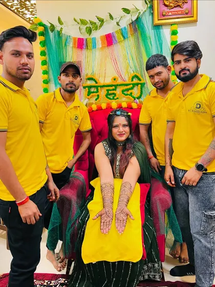 The team with a bride at her beautifully decorated mehndi function.