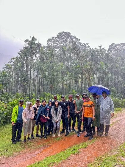 Our group huddled together in the rain, still all smiles, on the Kodachadri trail.