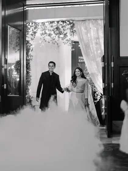 A grand entrance through a cloud of smoke. We love creating these dramatic and memorable entry moments for our couples.