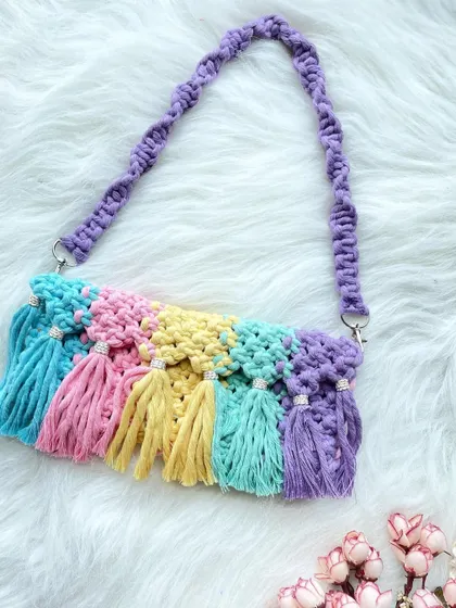 For those who love color, this rainbow tassel bag is pure joy. Each tassel is a different pastel shade, creating a fun, eye-catching accessory that's sure to make you smile.