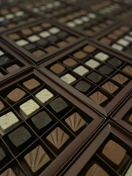 An array of our 16-piece truffle boxes, showcasing different flavors and textures. A perfect choice for corporate gifting or large family celebrations.