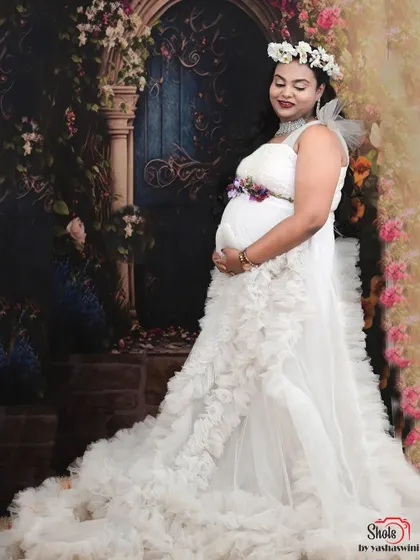 This white ruffle gown is perfect for creating a pure and angelic look for your maternity shoot. The layers of tulle are soft and photograph beautifully in the studio.
