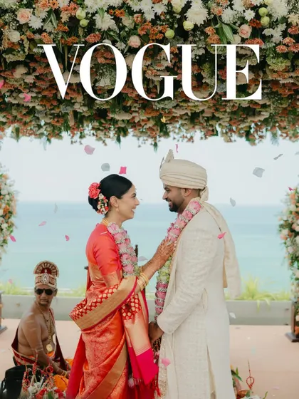 Featured in Vogue India, this shot captures the beautiful fusion of Tamil and Maharashtrian traditions at a coastal wedding in Sri Lanka. The vibrant colors of the bride's Kanjeevaram sari pop against the serene ocean backdrop.
