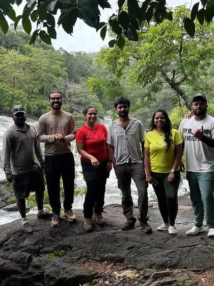 A group photo on a rock by a flowing stream. These are the perfect spots to take a break, click some pictures, and just enjoy the scenery.