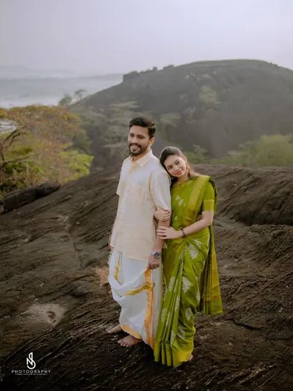 A classic couple portrait, with her leaning on his shoulder, showcasing their comfortable and easy connection.