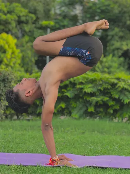 Finding balance in a scorpion handstand. Yoga teaches us to find this balance in all parts of life, not just on the mat.