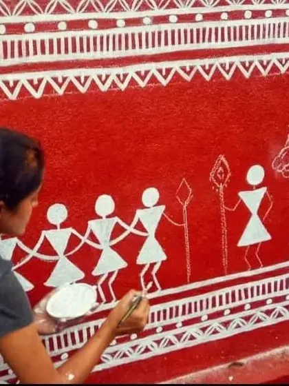 The classic combination of red and white in this Warli art piece creates a vibrant and earthy feel, perfect for adding cultural depth to any wall.