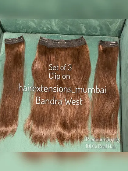 A standard set of 3 clip-on extensions in a light brown shade. Made from premium quality 100% real hair.