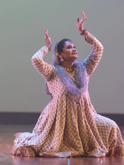 A seated pose in Kathak, demonstrating grace and control. Our training covers a wide range of movements, from intricate footwork to expressive seated postures.