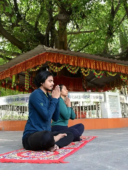 Praying and setting an intention before practice. This connects the physical movement to a deeper spiritual purpose.