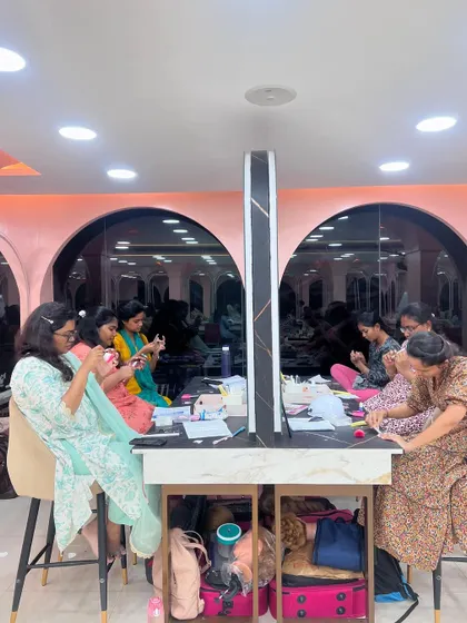 Another view of the nail art practice session, showing the collaborative and focused environment.