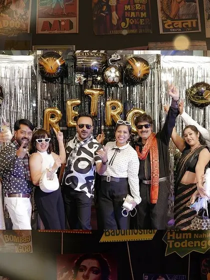 A fun group photo from a retro-themed party. I love capturing the energy of unique wedding events and celebrations.