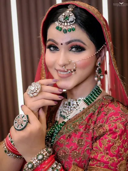 A classic smiling portrait. The bride's happiness is infectious, and the shot perfectly captures her complete bridal look from the chest up.