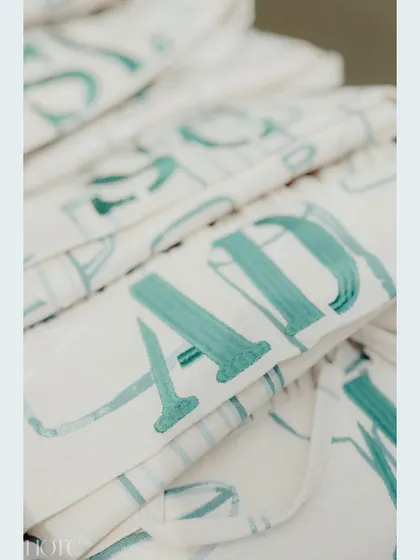 A close-up of the custom-printed aprons, showcasing the personalized touch we bring to every event.