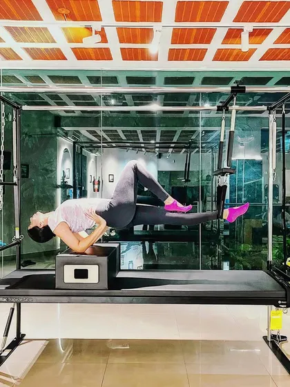 Limit none. This side plank hover on the Cadillac challenges the entire core and showcases incredible strength and stability.