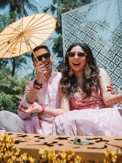 Laughter and joy at a daytime pre-wedding event. The custom-designed seating area provides a comfortable and stylish spot for the couple to relax and celebrate.