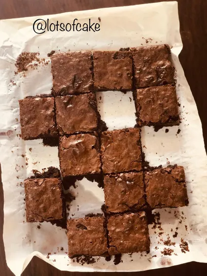 Sometimes I like to play jigsaw with my brownies. A fun overhead shot of a tray of brownies with one piece set aside.