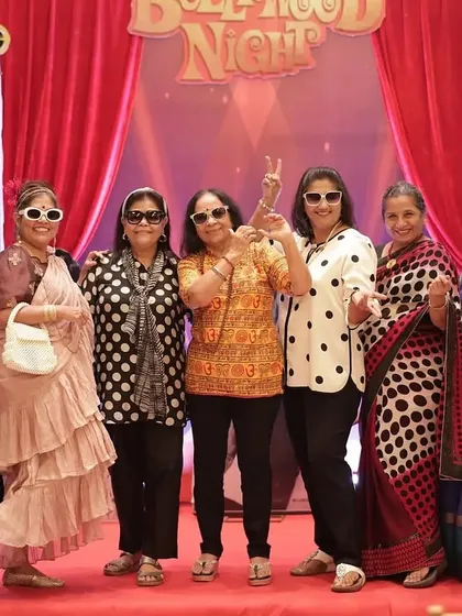 The ladies striking a pose in their retro sunglasses. The props and theme encouraged everyone to have fun.