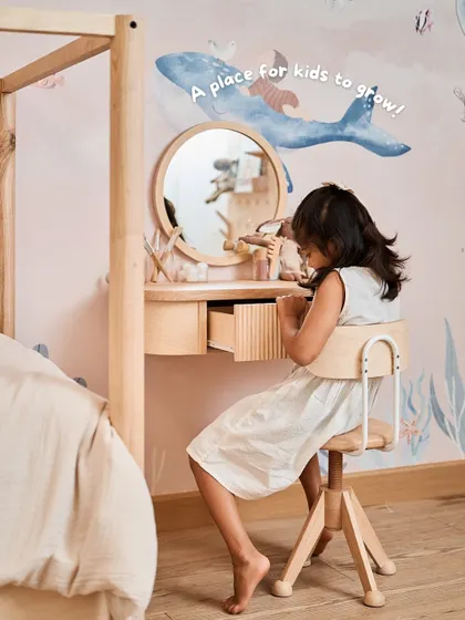 A child-sized dresser table and chair create a space for her to grow. It's her little corner for self-care routines, helping her build independence.