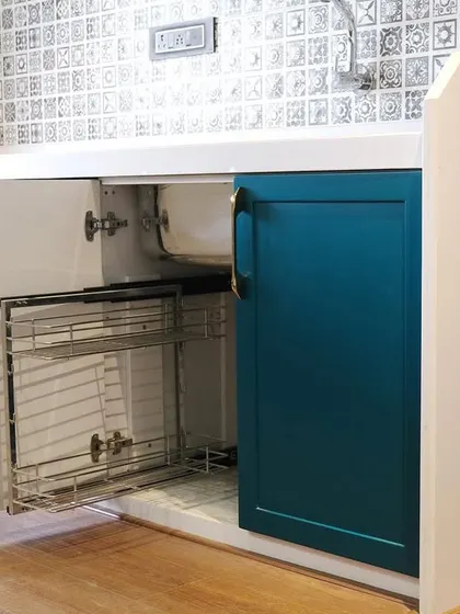 To maximize utility, we installed a pull-out basket system under the sink. This allows for easy access to cleaning supplies that are often stored in this hard-to-reach area.
