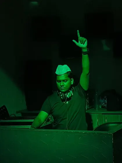 Under the green lights, telling a story with sound. Each track I select is a piece of a larger narrative I'm building for the dance floor.